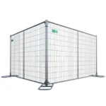 Temporary metal construction fence panel with supporting bases and a small green Broadfence sign on the mesh panel