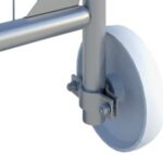 Close-up of a metal frame with a caster wheel and mounting bracket.